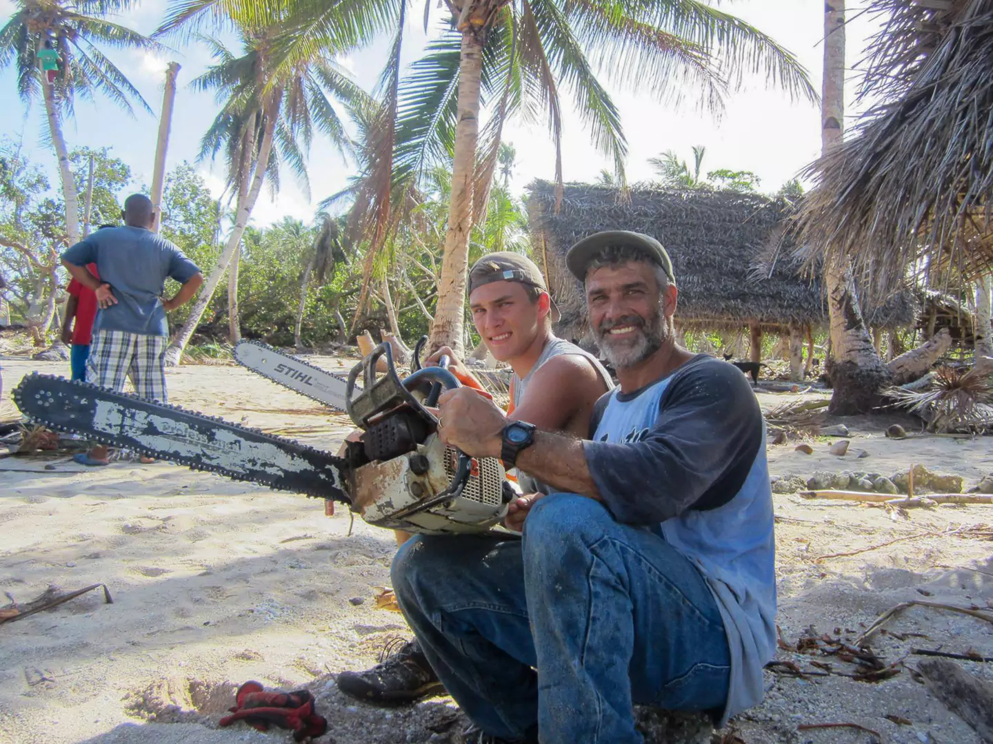 Joseph, founder of Generation Roofing, and his father constructing homes in Yap, Micronesia, exemplifying early roots of quality workmanship.